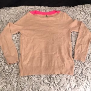 Beige sweater with pink accent on neckline